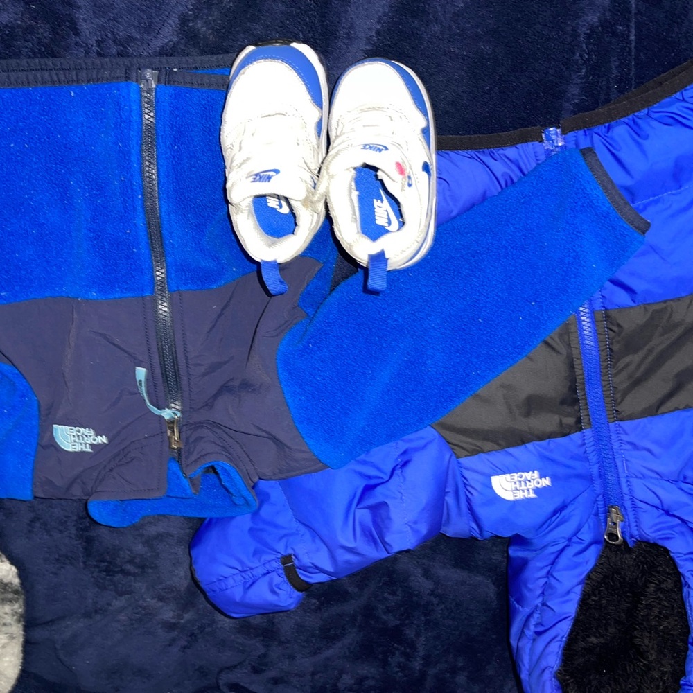 The North Face Blue and Black Jacket with White Sneakers